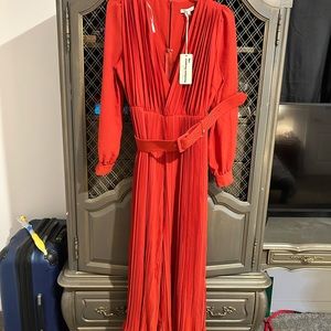 The Clothing Company NWT rust deep plunge jumpsuit. Bought from uniquevintage